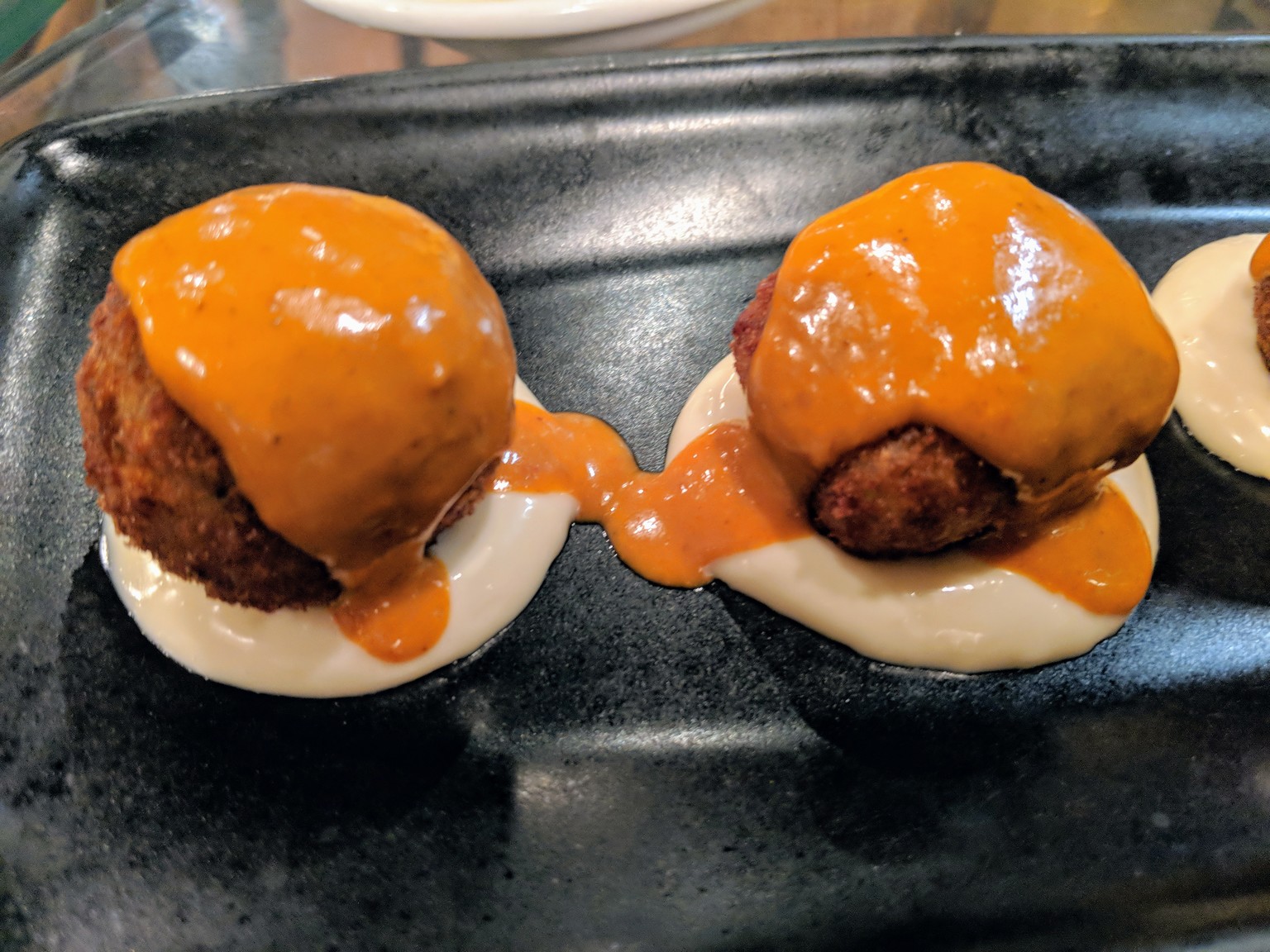 Fried rice balls, very similar to Italian arancini