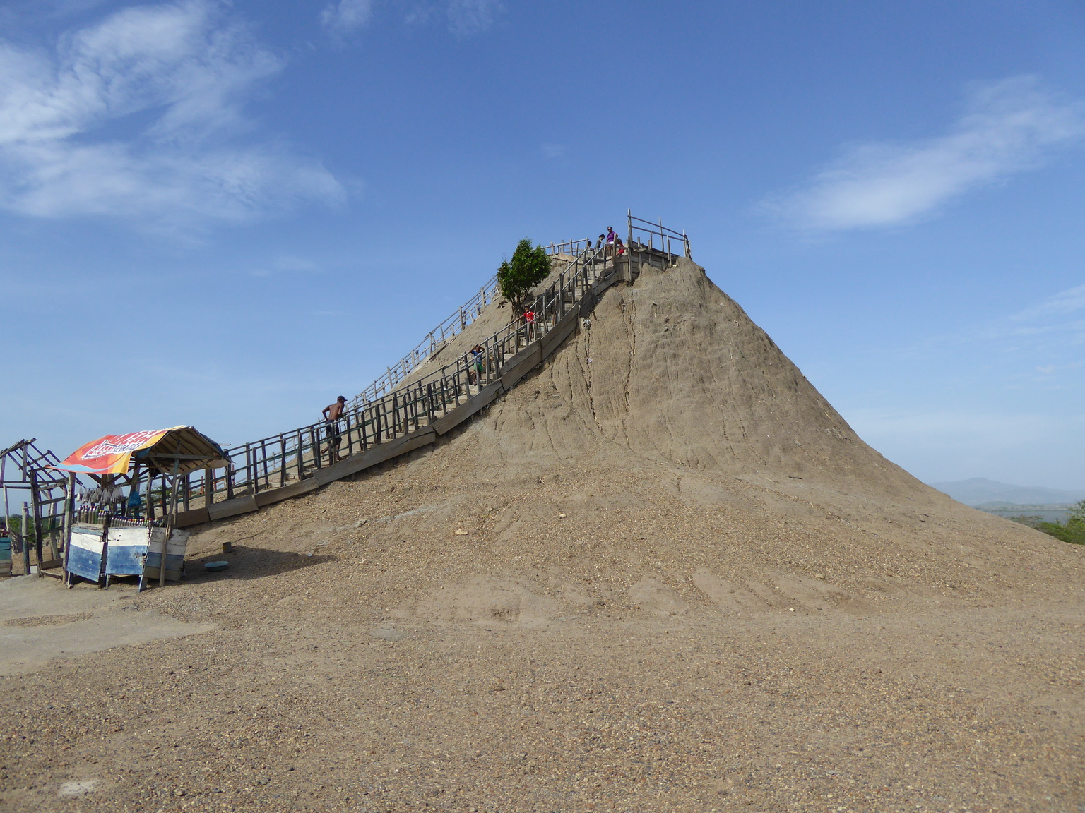 This is a mud "volcano," basically a natural mud bath that kept bubbling up to create this cone shape over the years. The mud is so dense that you can float right on top of it, it's quite an experience!