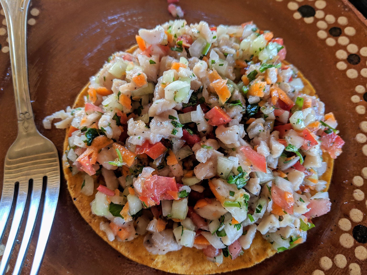 Ceviche tostada, really piled high