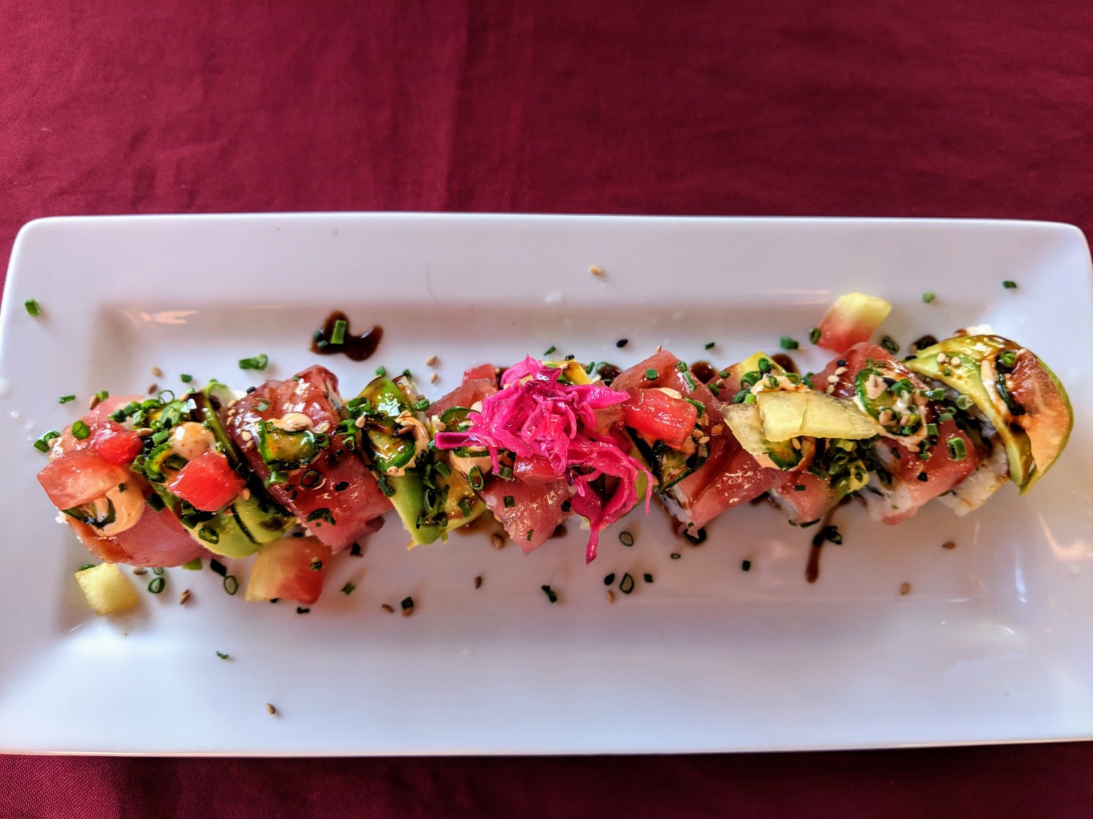Tuna and avocado topped sushi roll