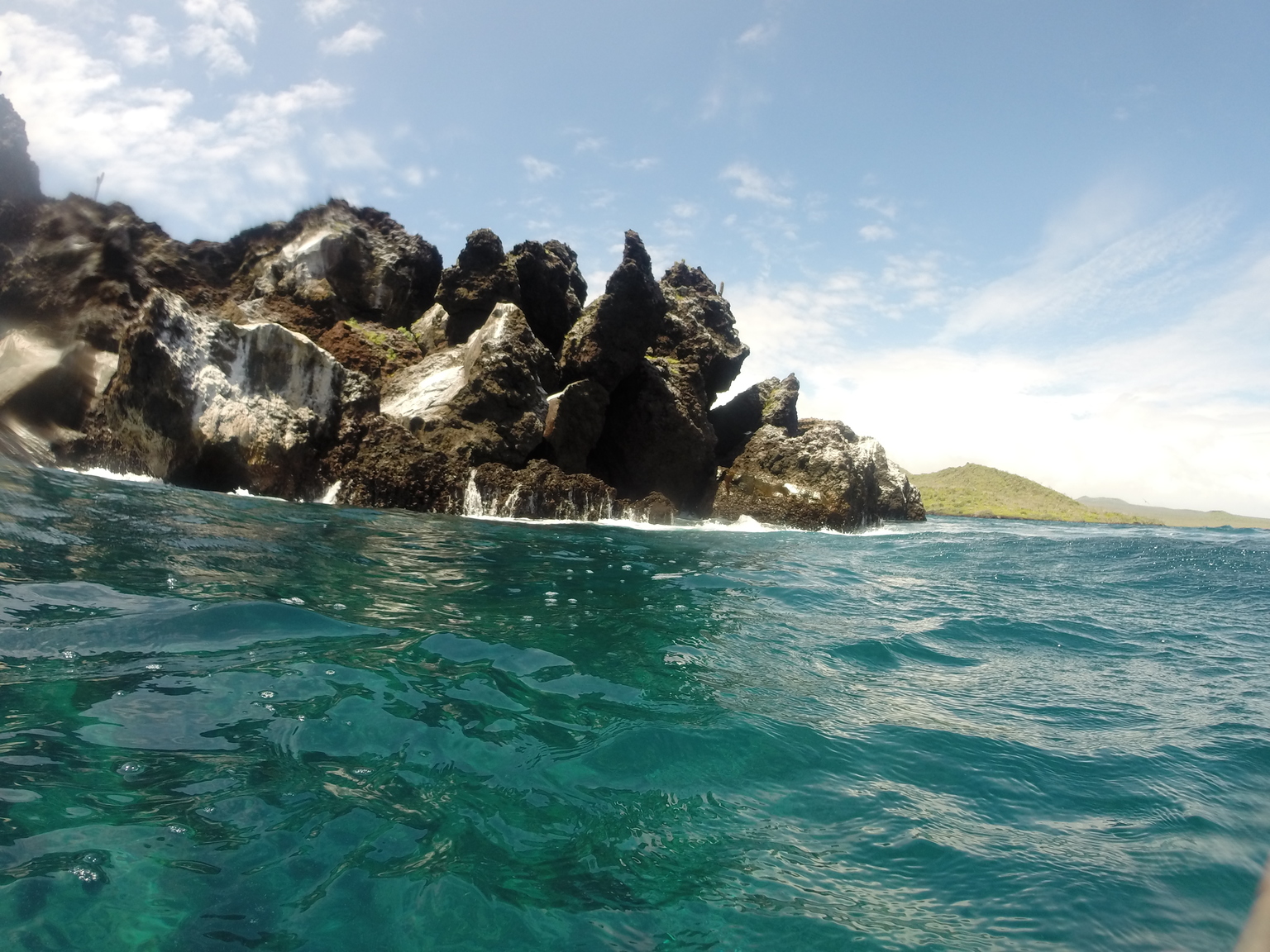 This was one of the coolest places I've ever snorkeled, it's called Devil's Crown. The current would pretty much carry you around the rock! We saw white tip reef sharks, sting rays and tons of fish, it was amazing!