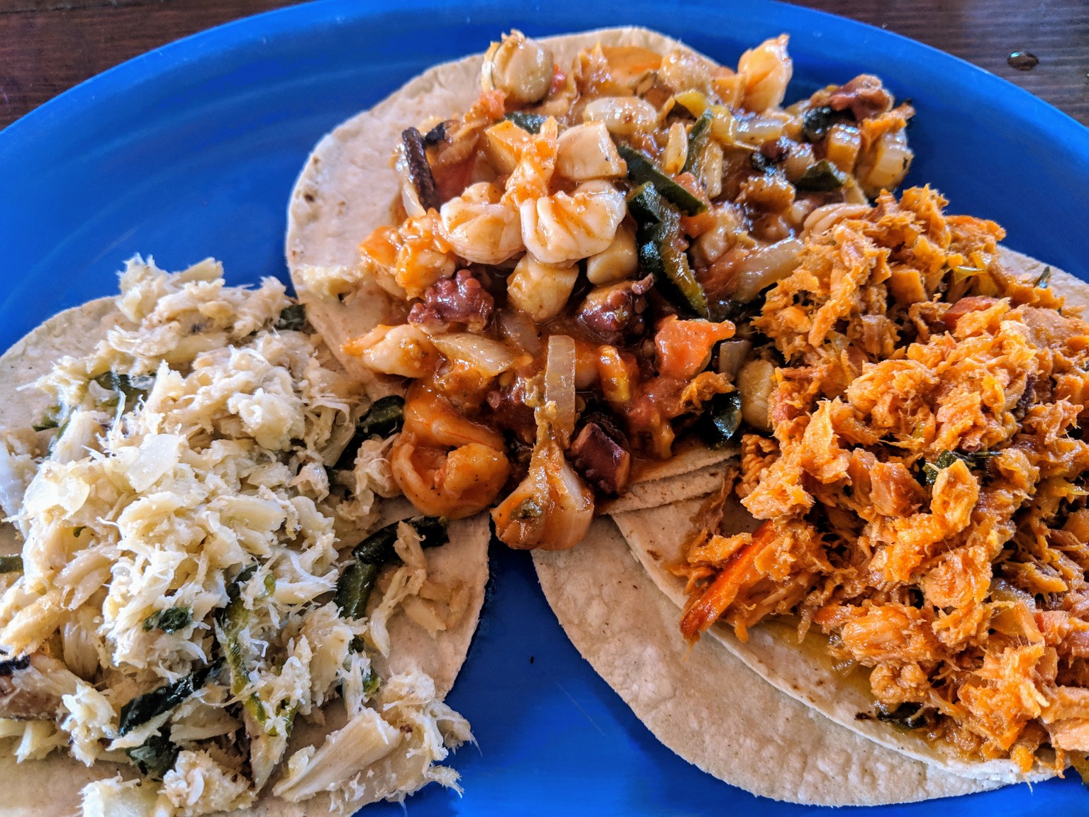 Crab, Marlin, and mixed seafood tacos.