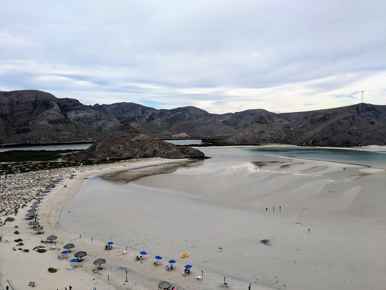 All the little palapas and umbrellas. Also, look how far the tide goes out!