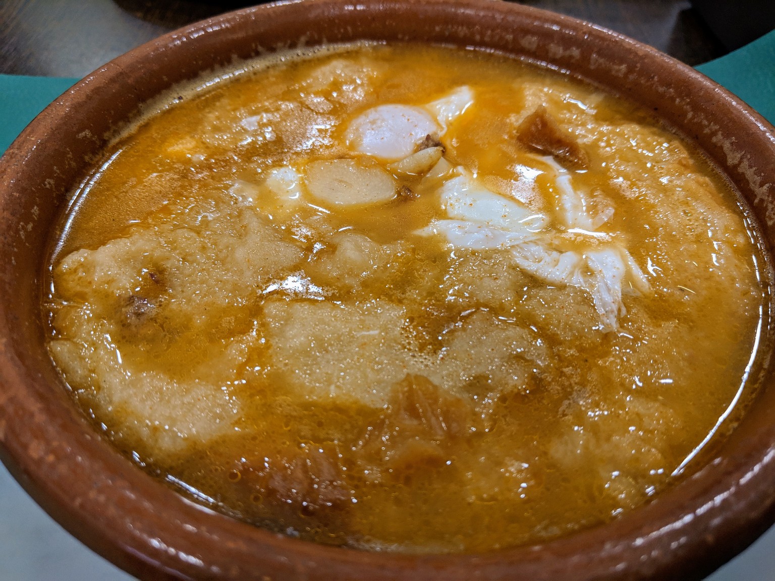 Sopa de Ajo, or garlic soup. It's got chunks of bread and poached eggs in it as well.