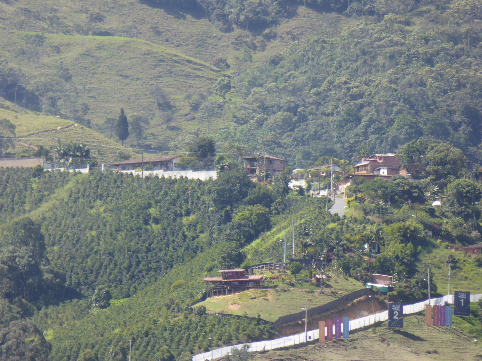 The complex at the top of the photo is the "prison" that Pablo Escobar had built for himself as part of a deal with the government. He continued to run his drug empire from here until Colombia, international pressure, passed a constitutional amendment that would allow is his extradition. 