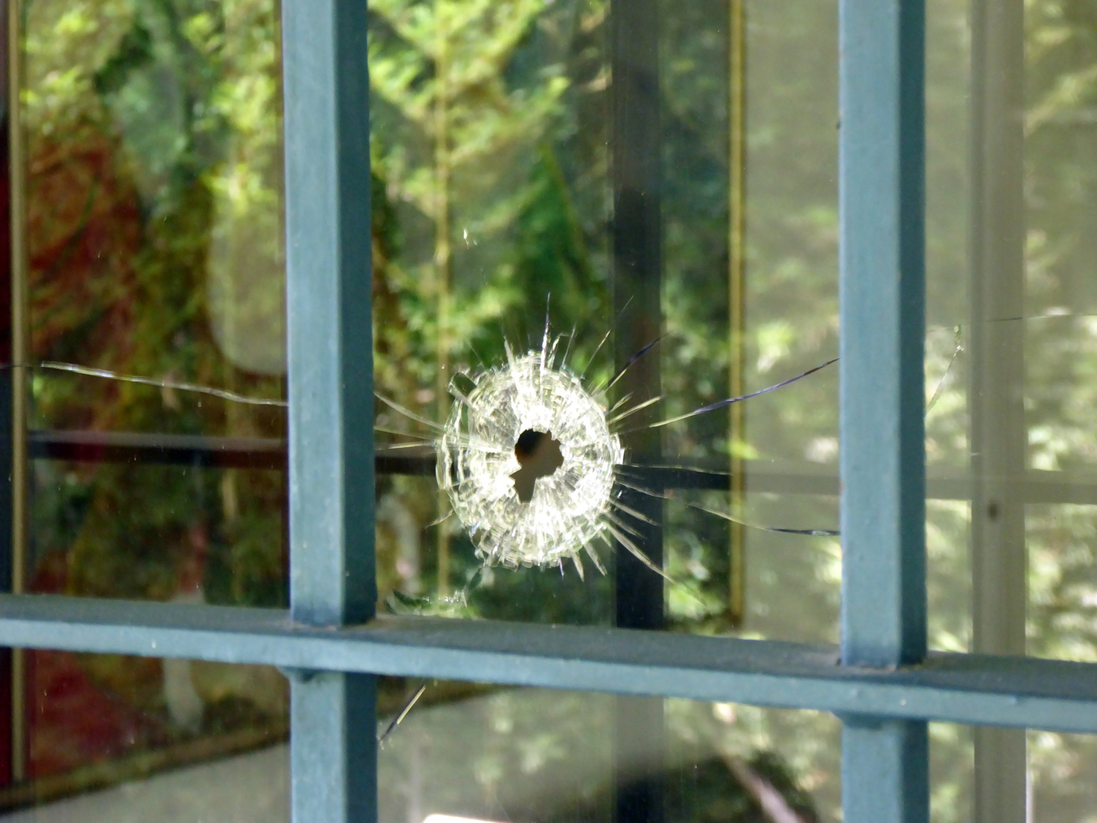 This is a bullet hole in the window of a house that belonged to Pablo Escobar's mother. Years after Pablo's death, a group of armed men came to house try to find buried money they believed is still there. The police showed up and they were killed in a shootout.