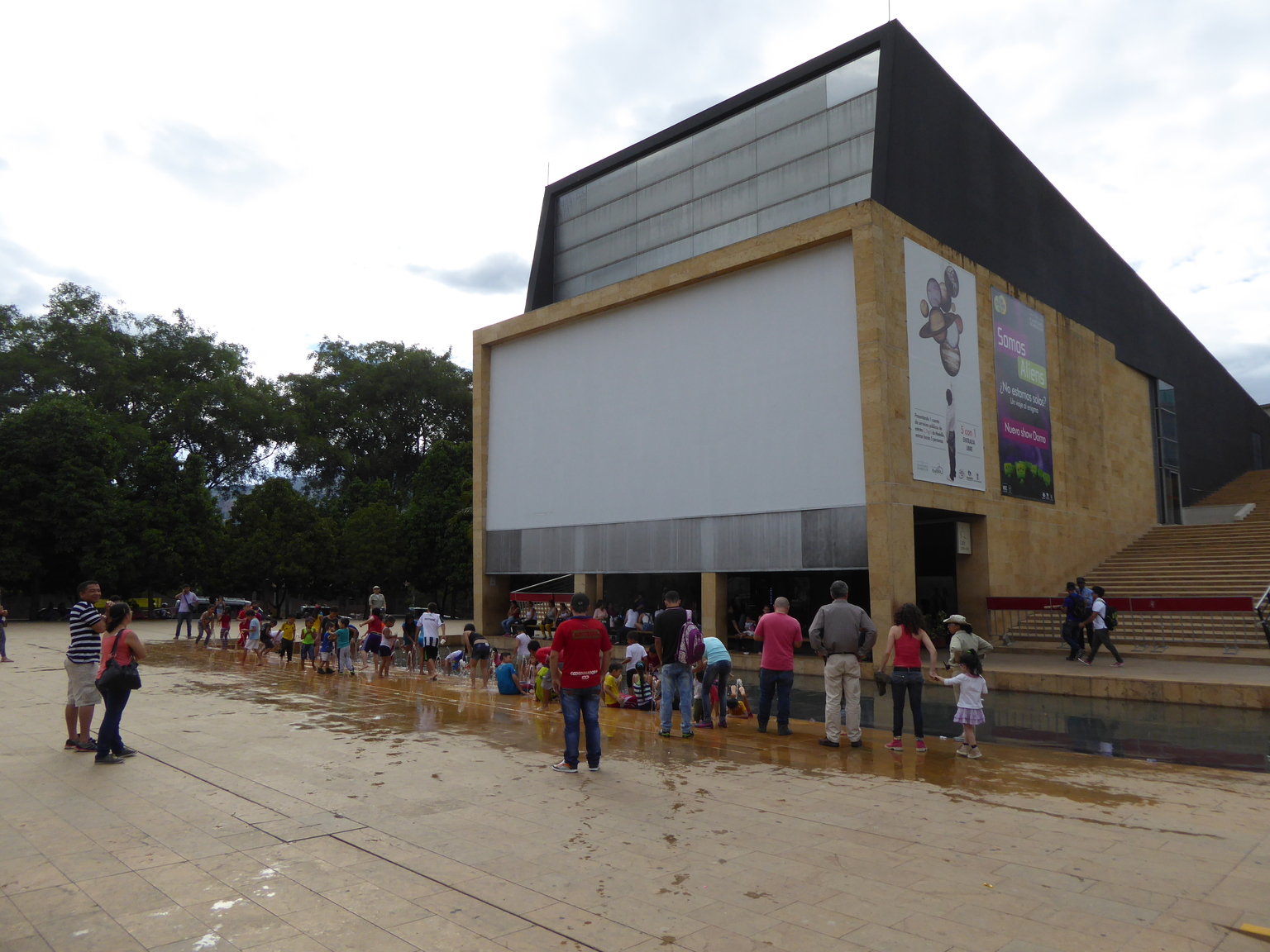 Kids playing in the fountains in front of the planetarium.