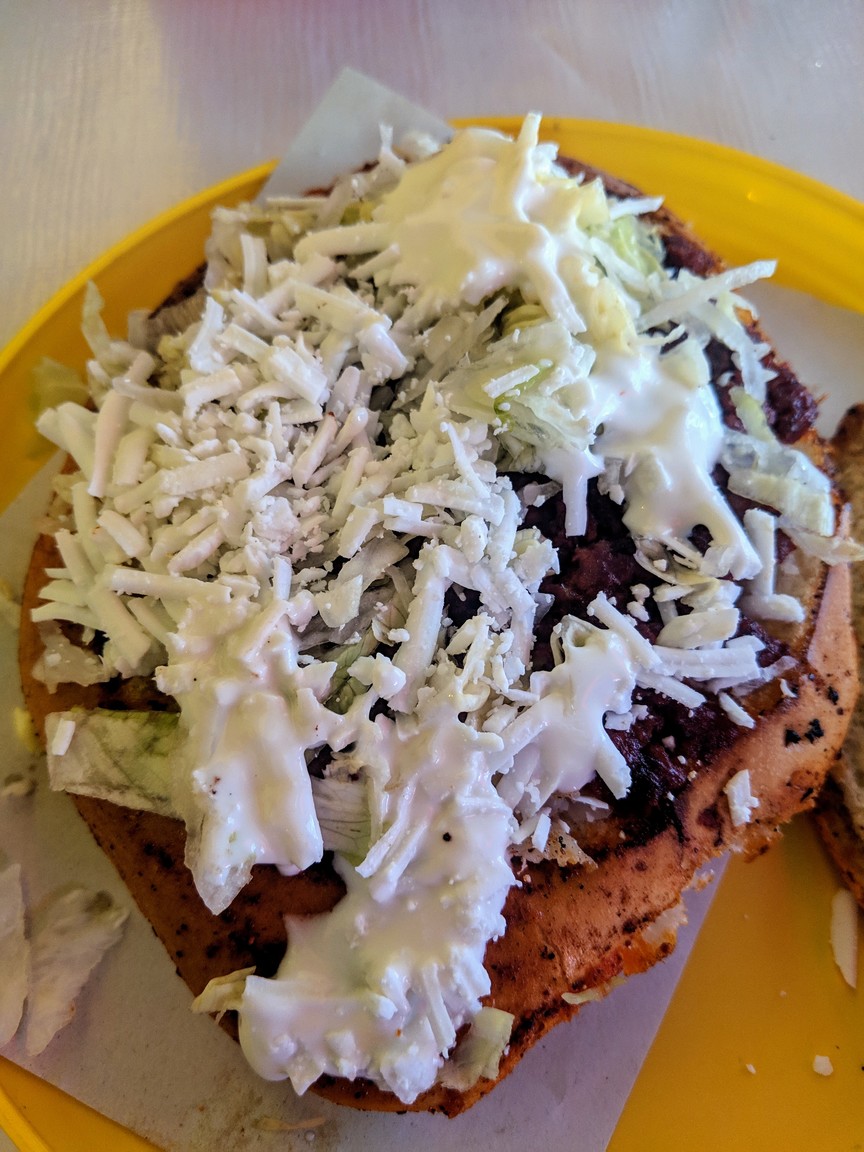 Pambazo, a tasty sandwich with chorizo, fresh cheese, and sour cream.