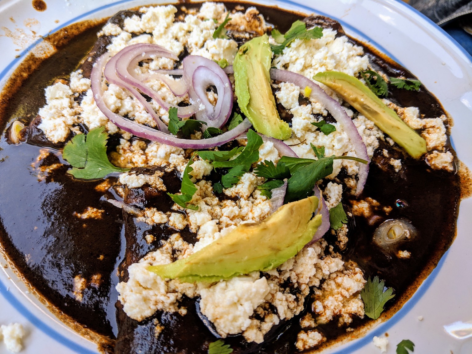 Enmolatas, which are enchiladas with mole sauce. Mole was invented in Oaxaca, and is a big specialty here.