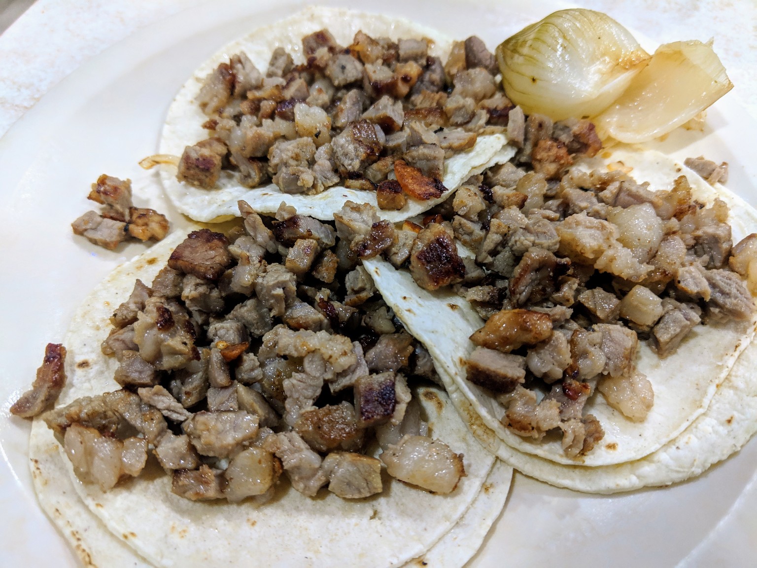 Rib meat tacos with roasted onion on the side... So good!