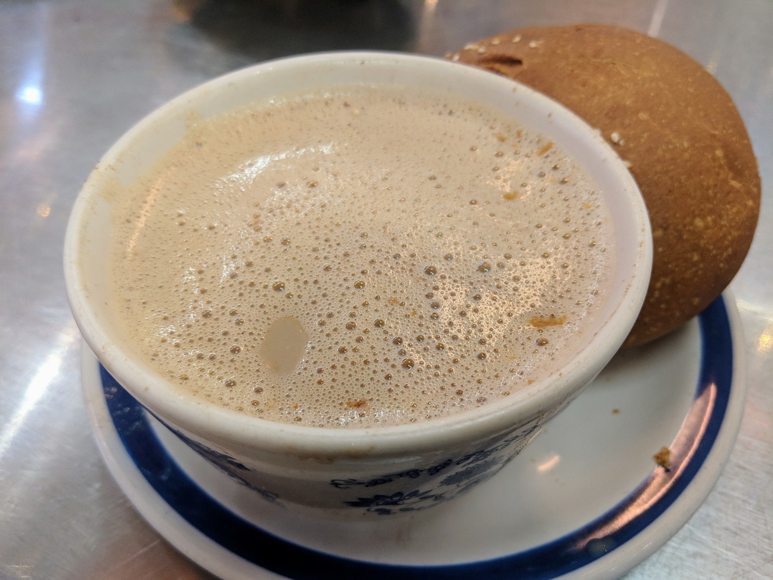 Mexican hot chocolate, served with a sweet bread roll.