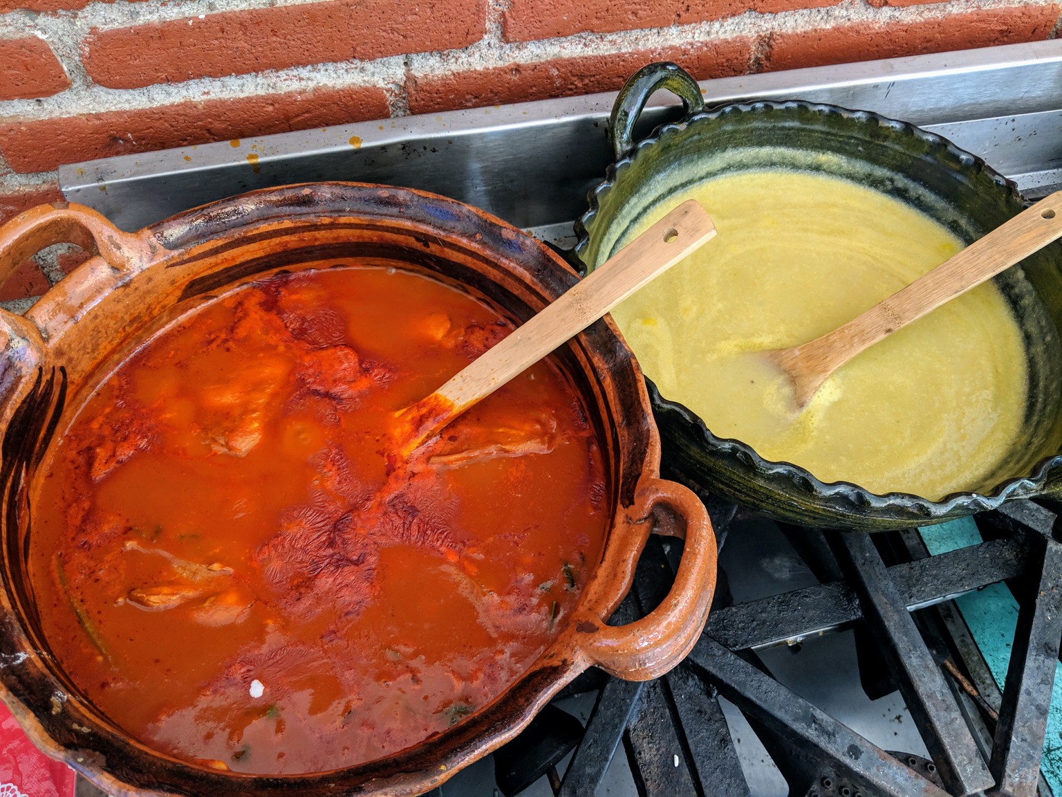 Mole amarillo and potato cream soup simmering. Amorillo means yellow, but then why is it red? Apparently it was originally made with a yellow pepper, but now most people make it with other peppers, which are red.