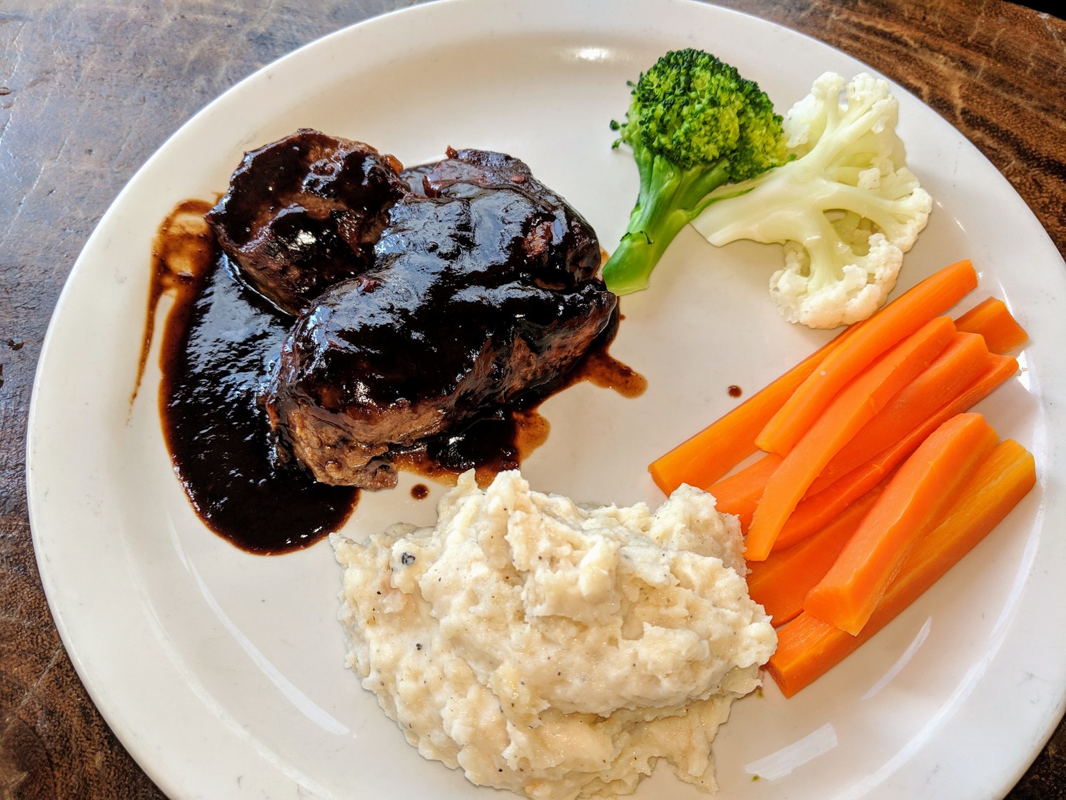 Steak with tamarind sauce and garlic mashed potatoes.