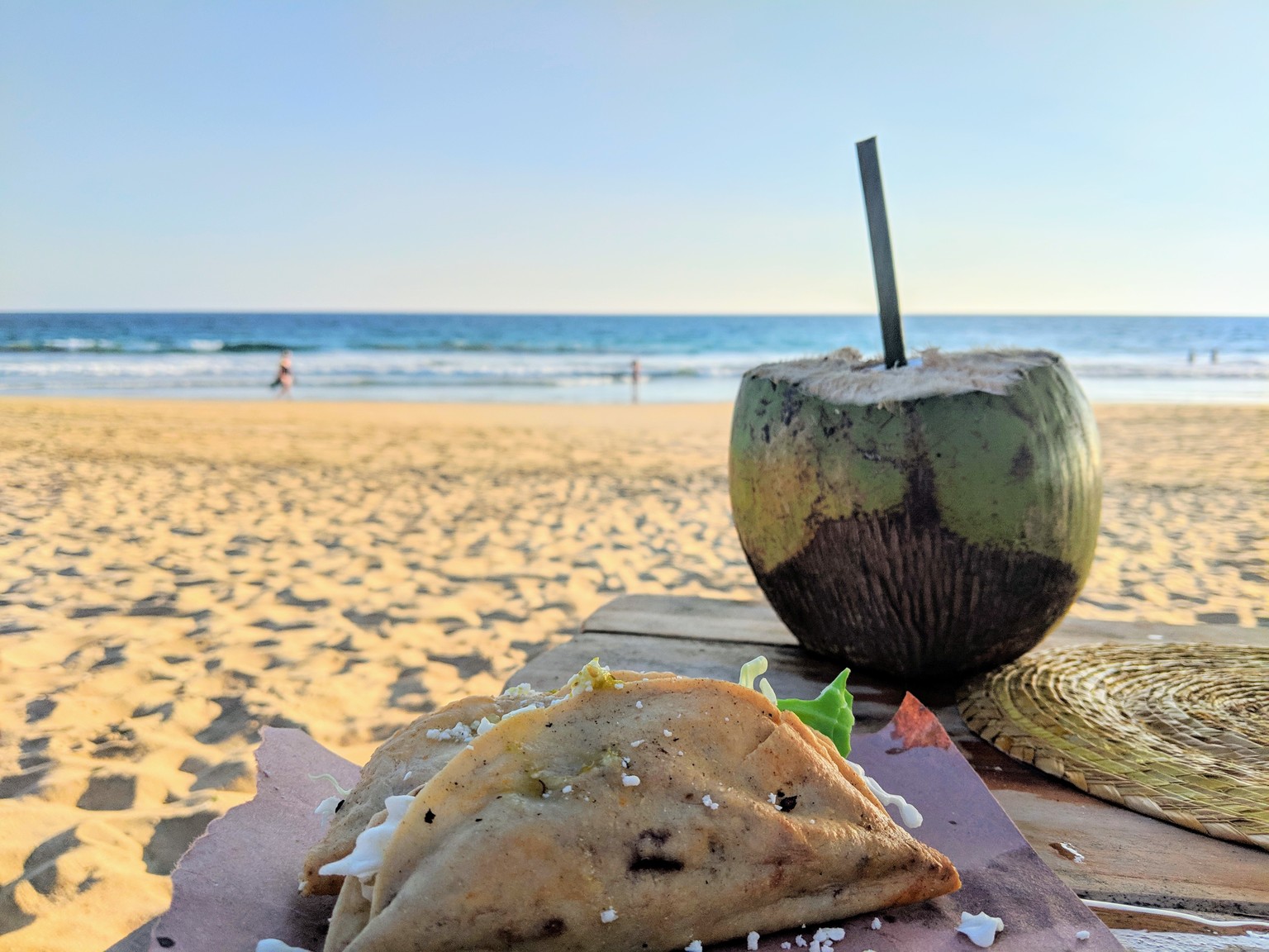 Fish tacos and fresh coconut water on the beach
